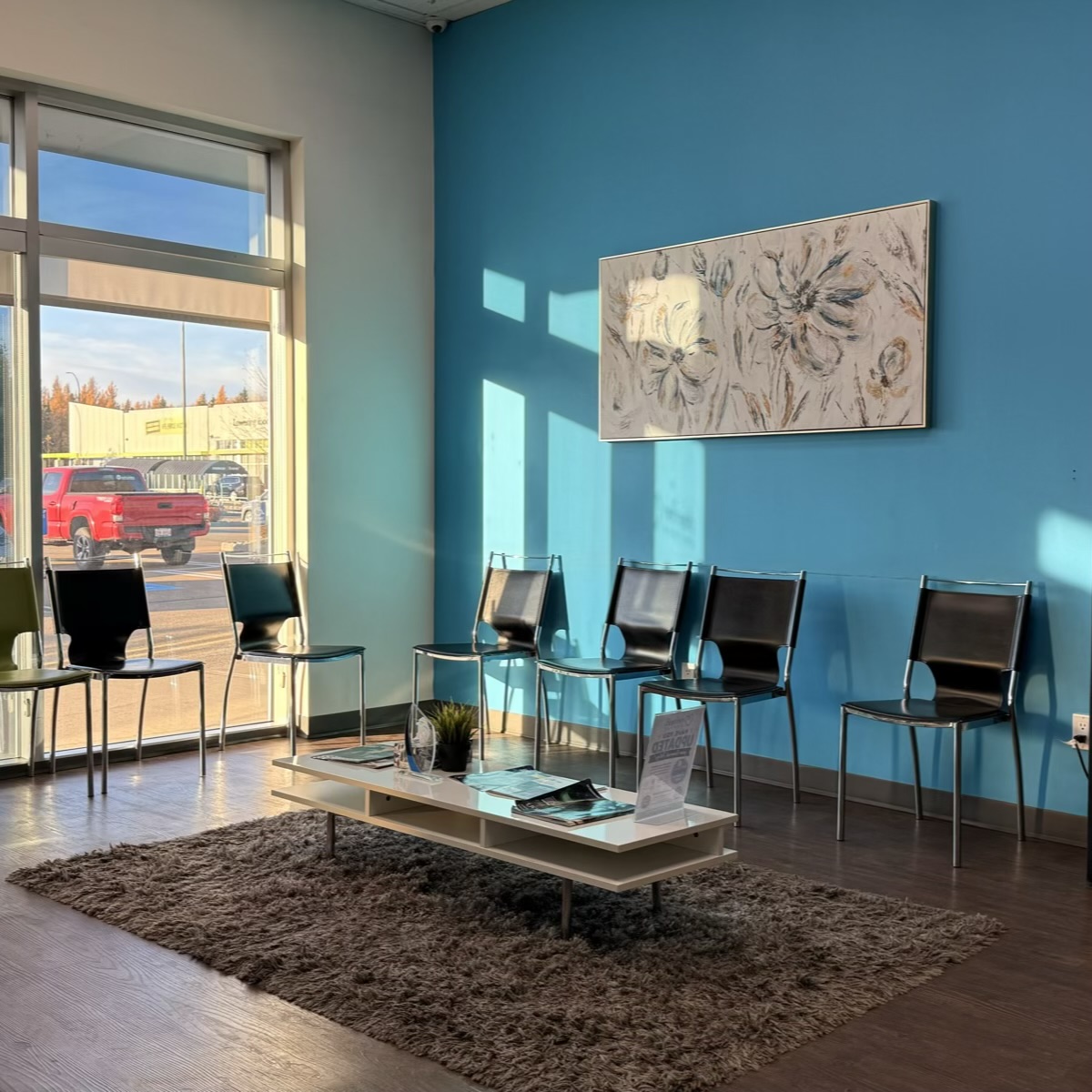 Reception and seating area at Refresh Dental in West Edmonton on Webber Greens Drive